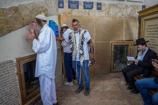Jews pray at the tomb of Rabbi Akiva, a sage from the latter part of the first century and the beginning of the second, in the northern Israeli city of Tiberias, May 22, 2024. Photo by Ayal Margolin/Flash90.