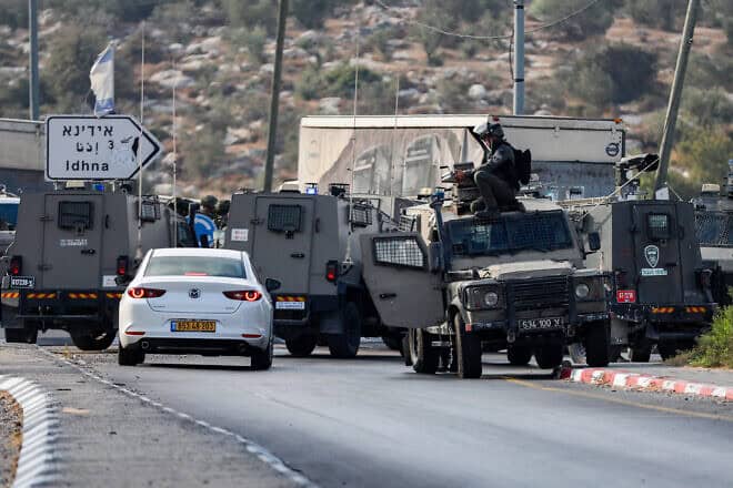 Israeli security forces stand guard at the scene of a shooting attack, near Tarqumiyah, in Judea, Sept. 1, 2024. Photo by Wisam Hashlamoun/Flash90.