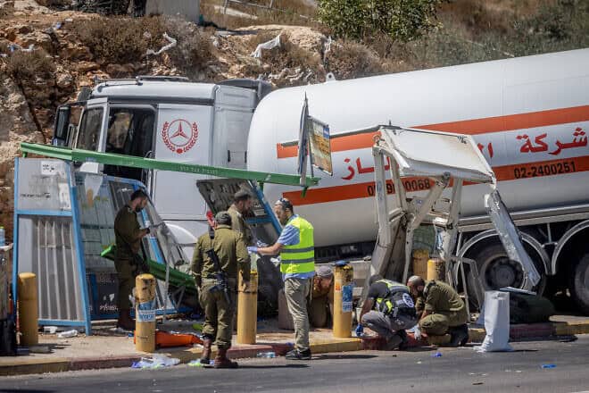 The scene of a terrorist truck-ramming attack near Beit El in Samaria that killed an Israeli soldier, Sept. 11, 2024.  Photo by Chaim Goldberg/Flash90.