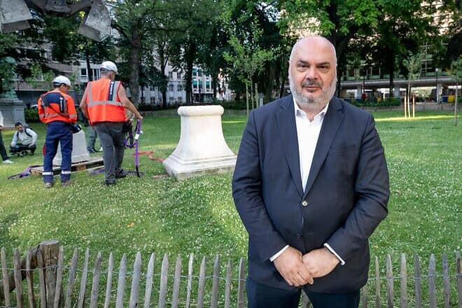 Ixelles-Elsene Mayor Christos Doulkeridis poses for the photographer during the removal of a monument of General Storms from its original place in the square de Meeus to be placed elsewhere, in Ixelles - Elsene, Brussels, Thurs. June 30, 2022. Photo by Hatim Kaghat/BELGA MAG/AFP via Getty Images.