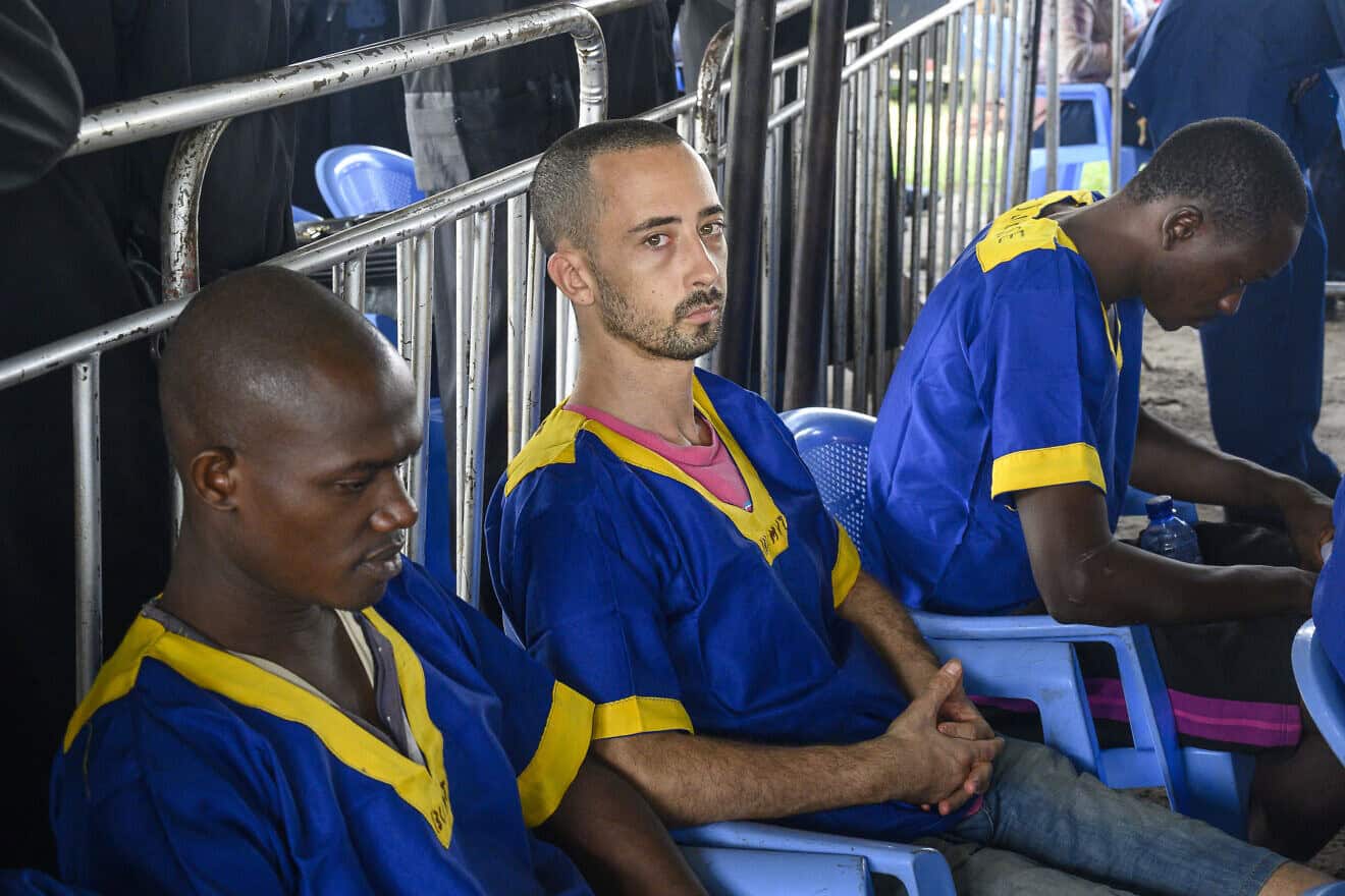 U.S. national Benjamin Zalman-Polun (C) sits among other accused of a failed coup attempt at the Ndolo Prison in Kinshasa on June 7, 2024. Photo by Arsene Mpiana/AFP via Getty Images.