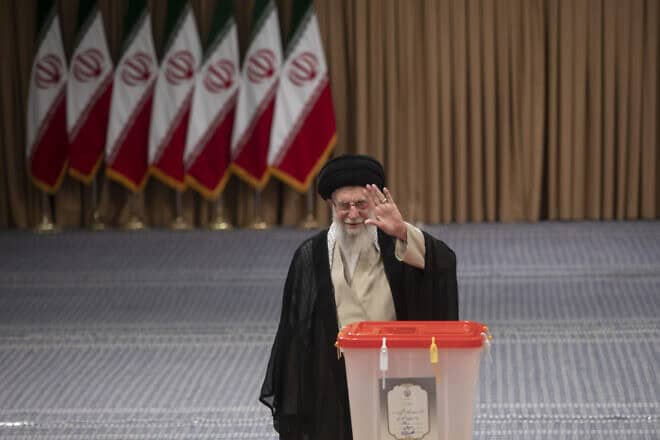 Iranian Supreme Leader Ayatollah Ali Khamenei waves after casting his vote for the presidential runoff election on July 5, 2024 in Tehran, Iran. Photo by Majid Saeedi/Getty Images.