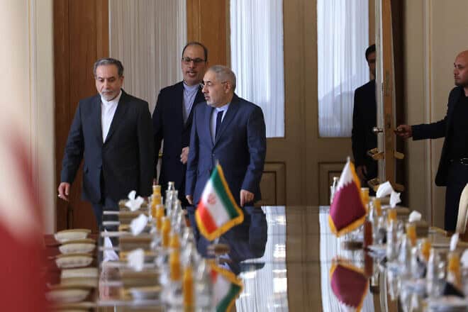 Iran's new foreign minister, Abbas Araghchi (L), arrives to a meeting with his Qatari counterpart in Tehran on Aug. 26, 2024. Photo by Atta Kenare/AFP via Getty Images.