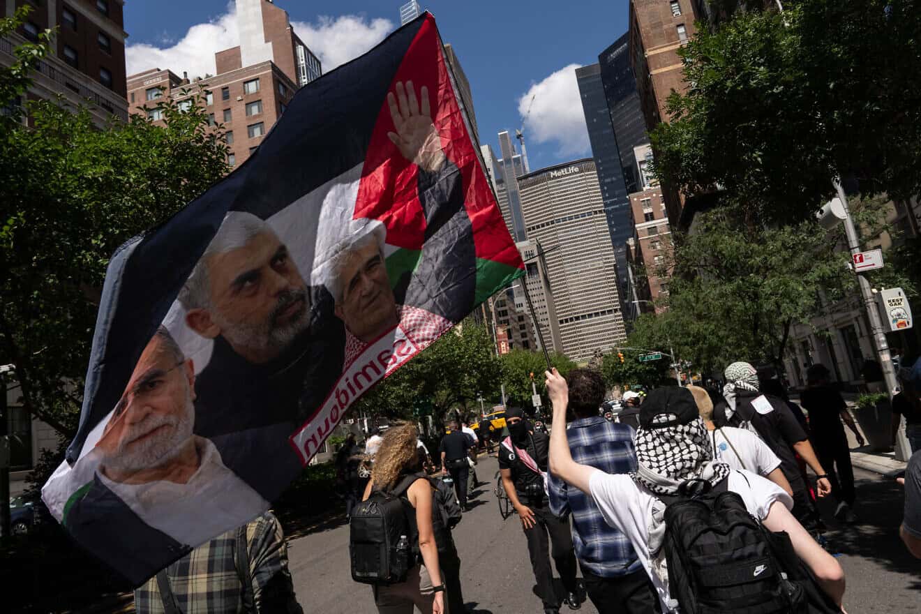A person holds a flag with an image of Yahya Sinwar as people attend a protest against the war in Gaza, on Labor Day on Sept. 2, 2024 in New York City. Photo by Adam Gray/Getty Images.