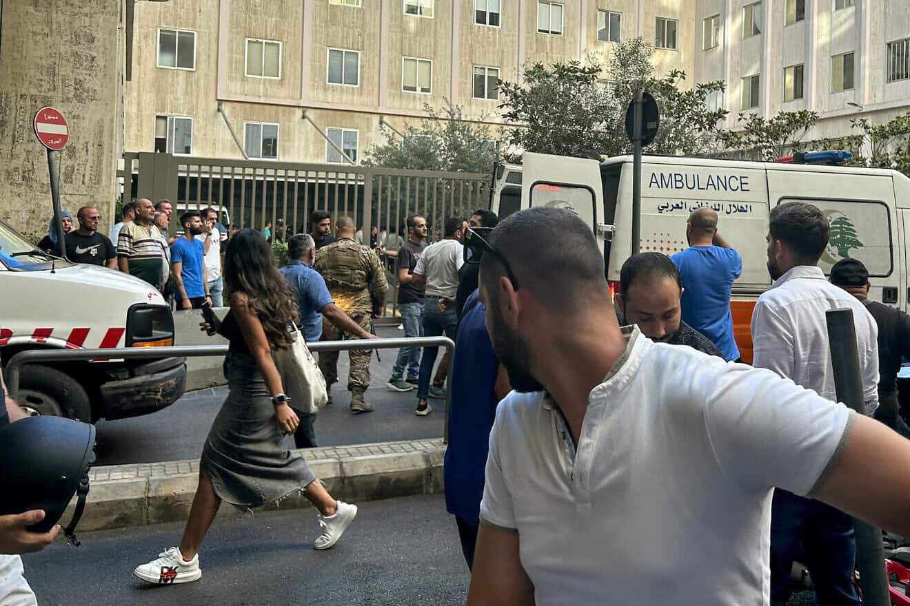 People react near an ambulance as the wounded are brought to a hospital in Beirut on Sept. 17, 2024. Photo by Anwar Amro/AFP via Getty Images.