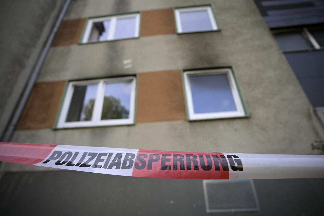A police cordon is i front of an apartment building in Essen, western Germany, on Sept. 29, 2024, the day after a fire broke out at the building. A 41-year-old Syrian suspect has been arrested after fires broke out at two apartment blocks and a van was rammed into shops in the western Germany city of Essen, police said on Sept. 29. Photo by Sascha Schuermann/AFP via Getty Images.