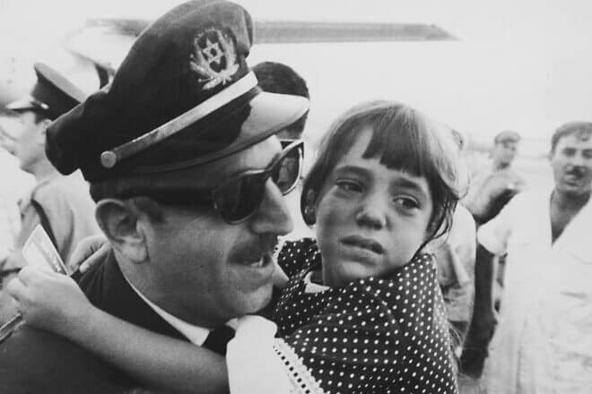 Flight engineer Yona Lichtman is reunited with his daughter at Lod Airport in Israel, after his El Al aircraft was hijacked by members of the Popular Front for the Liberation of Palestine, Sept. 4, 1968. Photo by Keystone/Hulton Archive/Getty Images.