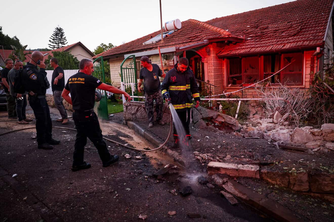Israeli security forces, firefighters and civilians at the site where a missile fired by Hezbollah in Lebanon hit a house in Rosh Pina, in northern Israel, on Sept. 26, 2024. Photo by David Cohen/Flash90.