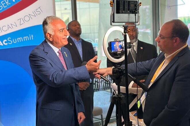 Reza Pahlavi, the exiled Iranian crown prince, speaks with Mike Wagenheim, of JNS, at the Israeli-American Council summit in Washington, D.C., on Sept. 20, 2024. Photo by Menachem Wecker.