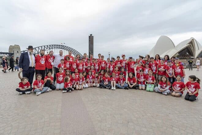 JewQ Australia competition finalists, representing 57 schools from 15 Australian communities in three states, take time out for a group photo in front of the Sydney Opera House, Sept. 8, 2024. Photo by Gary Friedland.