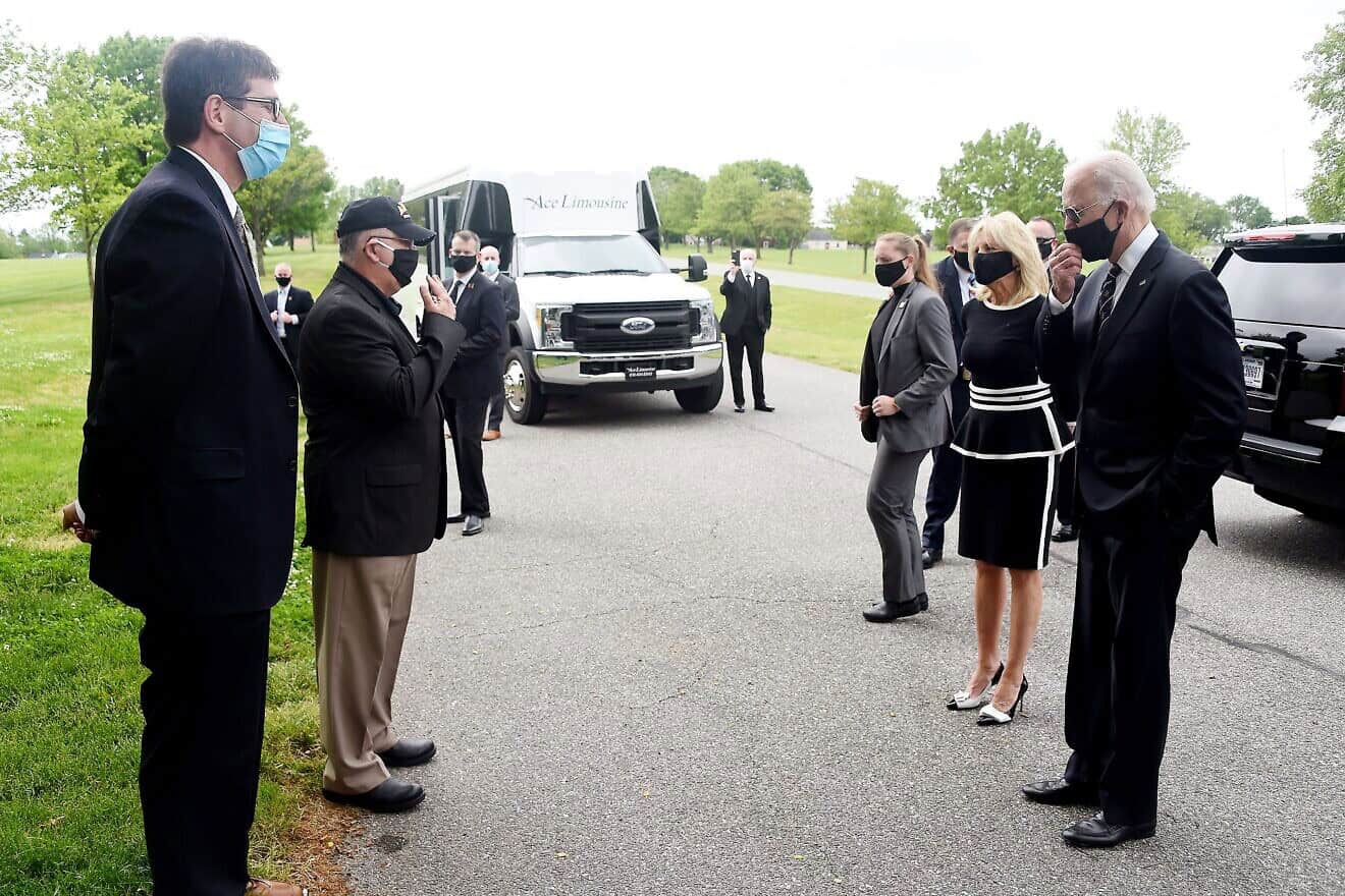 Democratic presidential candidate and former U.S. Vice President Joe Biden and his wife, Jill Biden, speak to Matt Meyer (left), county executive of New Castle County, and General Francis D. Vavala on Memorial Day at Delaware Memorial Bridge Veteran's Memorial Park in New Castle, Del., May 25, 2020. Photo by Oliver Douliery/AFP via Getty Images.