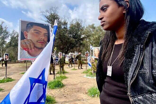 A woman visits the site of the Nova Festival. Photo by Ziv Coren for Mekimi.