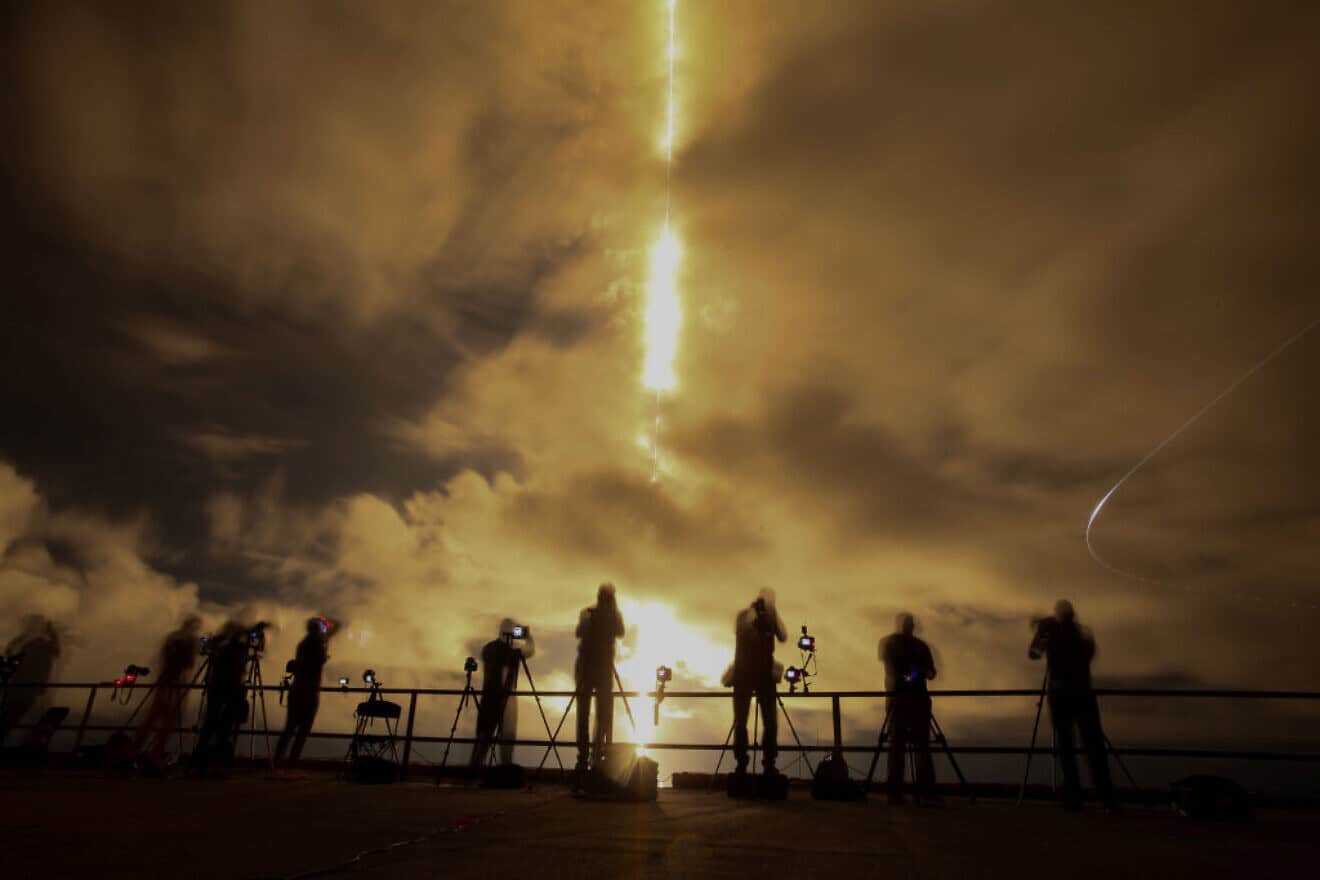 A slow shutter speed captures a streak of light from the engines on SpaceX's Polaris Dawn Falcon 9 rocket as it blasts off from Launch Complex 39A of NASA's Kennedy Space Center in Cape Canaveral, Florida, on Sept. 10, 2024. Photo by Joe Raedle/Getty Images.