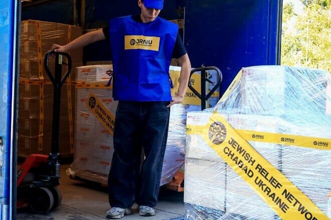 Unloading pallets of food items that will be sent across Ukraine to Jewish communities large and small in advance of Rosh Hashanah, which starts the evening of Oct. 2, 2024. Credit: Courtesy of the Jewish Relief Network Ukraine.