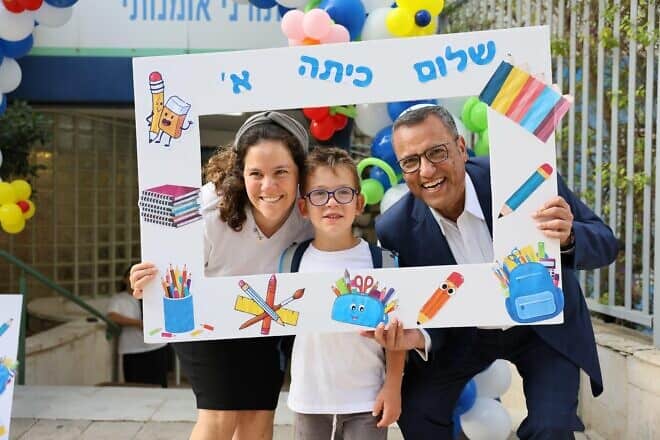 Jerusalem Mayor Moshe Lion and 6-year-old Achiya Zenilman on the first day of school in Jerusalem, Israel, Sept. 1, 2024. Achiya's father fell in combat in southern Gaza in December. Photo by Arnon Bosani.