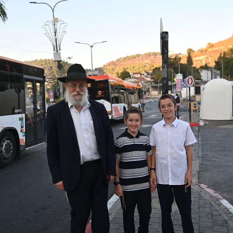A resident of Safed and his sons stand near a bomb shelter in Safed, Israel, on Sept. 25, 2024. Photos by Canaan Lidor.