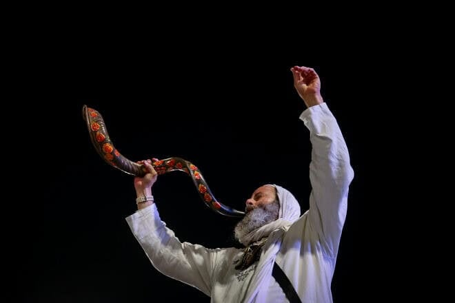 The blowing of the shofar as Jews arrive for Selichot penitential prayers at the Western Wall Plaza in Jerusalem two days before Yom Kippur, Oct. 9, 2024. Photo by Chaim Goldberg/Flash90.