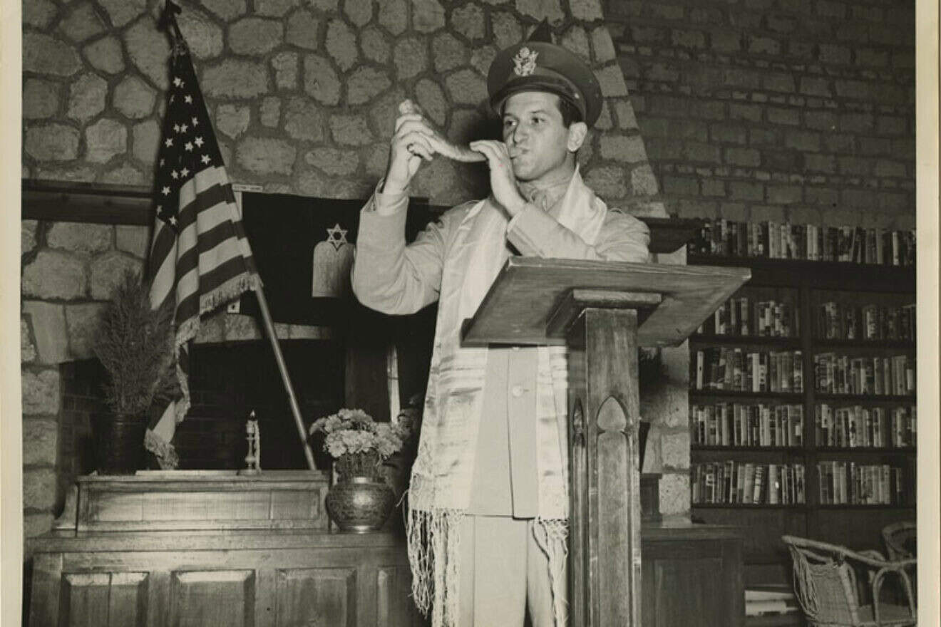 U.S. Chaplain Joseph H. Freedman of the U.S. Army Forces in the Middle East blows the shofar during Rosh Hashanah. Photo by Sgt. E.M. Henderson/S.C., Signal Corps. via the Center for Jewish History.