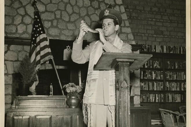 U.S. Chaplain Joseph H. Freedman of the U.S. Army Forces in the Middle East blows the shofar during Rosh Hashanah. Photo by Sgt. E.M. Henderson/S.C., Signal Corps. via the Center for Jewish History.