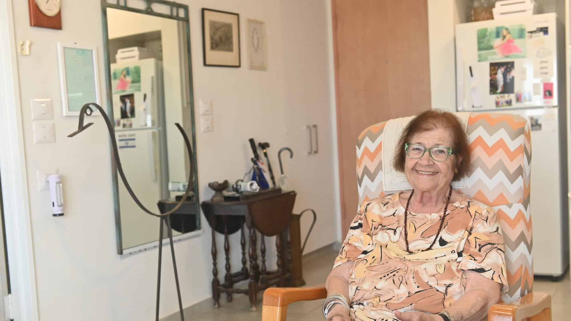 Mika Gelber sits in her living room in Herzliya, Israel, on Oct. 14, 2024. Photo by Canaan Lidor.