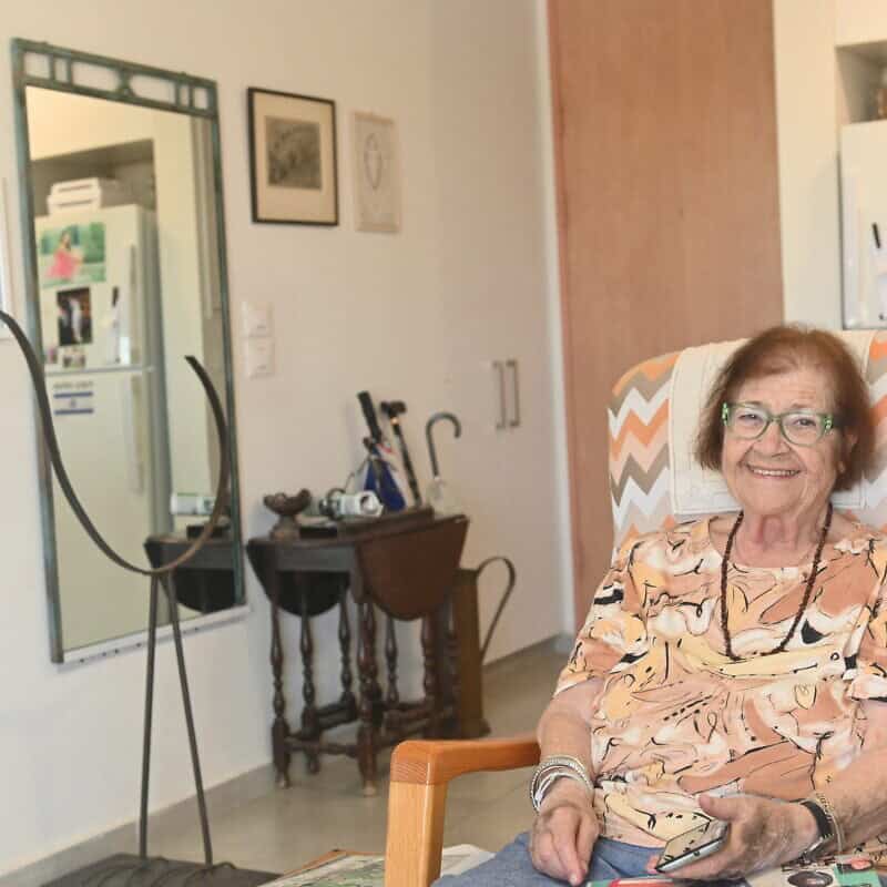 Mika Gelber sits in her living room in Herzliya, Israel, on Oct. 14, 2024. Photo by Canaan Lidor.