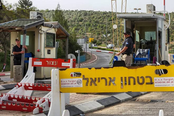 Security guards at the entrance to the city of Ariel in Samaria, April 30, 2022. Credit: Flash90.