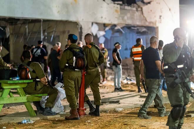 Israeli security personnel at the scene where an Iranian missile hit a school in Gedera, east of Ashdod, Oct. 1, 2024. Photo by Liron Moldovan/Flash90.