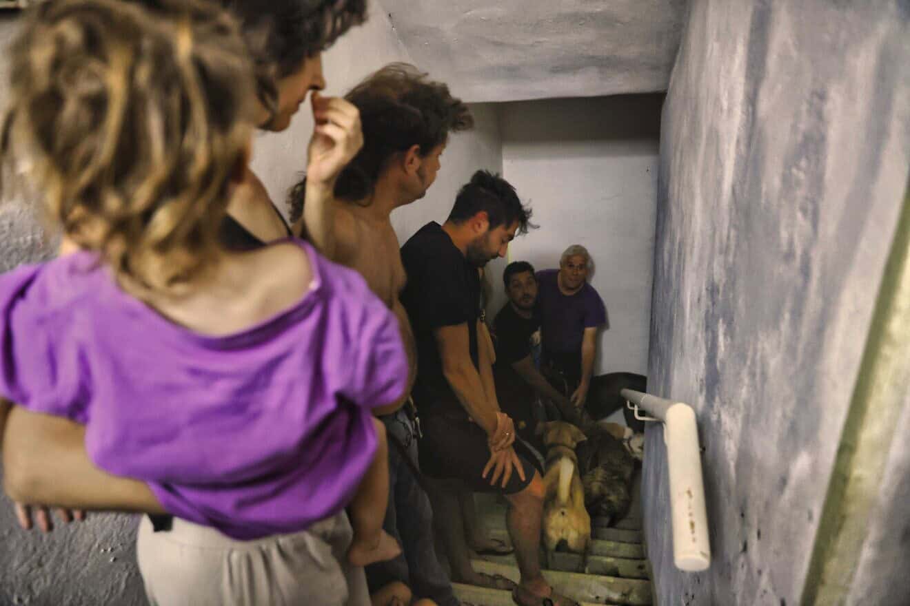 Israelis take cover as air-raid sirens are activated in Tel Aviv, Oct. 23, 2024. Photo by Yehoshua Yosef/Flash90.