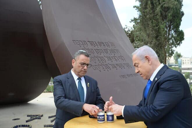 Prime Minister Benjamin Netanyahu and Jerusalem Mayor Moshe Lion light memorial candles at the Oct. 7 monument in the capital, Oct. 7, 2024. Photo by Amos Ben Gershom/GPO.