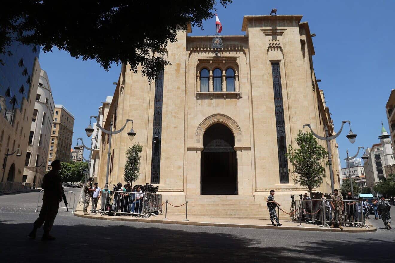 Journalists gather outside the parliament building during the 12th session to elect a new president in the capital Beirut's downtown district on June 14, 2023. Photo by Anwar Amro/AFP via Getty Images.