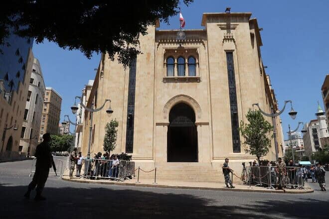 Journalists gather outside the parliament building during the 12th session to elect a new president in the capital Beirut's downtown district on June 14, 2023. Photo by Anwar Amro/AFP via Getty Images.