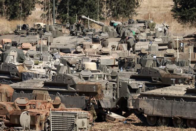 Israeli tanks and armoured vehicles are deployed in the Upper Galilee region of northern Israel near the border with Lebanon on Sept. 29, 2024. Photo by Menahem Kahana/AFP via Getty Images.