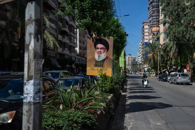 A picture of slain Hezbollah leader Hassan Nasrallah is displayed in a street in the Hezbollah stronghold of Dahiyeh, Oct. 2, 2024. Photo by Carl Court/Getty Images.