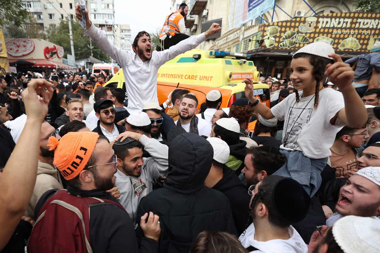 Jewish pilgrims pray on a street next to the tomb of Rabbi Nachman ahead of the Jewish new year of "Rosh Hashanah", in Uman, central Ukraine, on Oct. 2, 2024, amid the Russian invasion in Ukraine. Photo by Anatolii Stepanov/AFP via Getty Images.