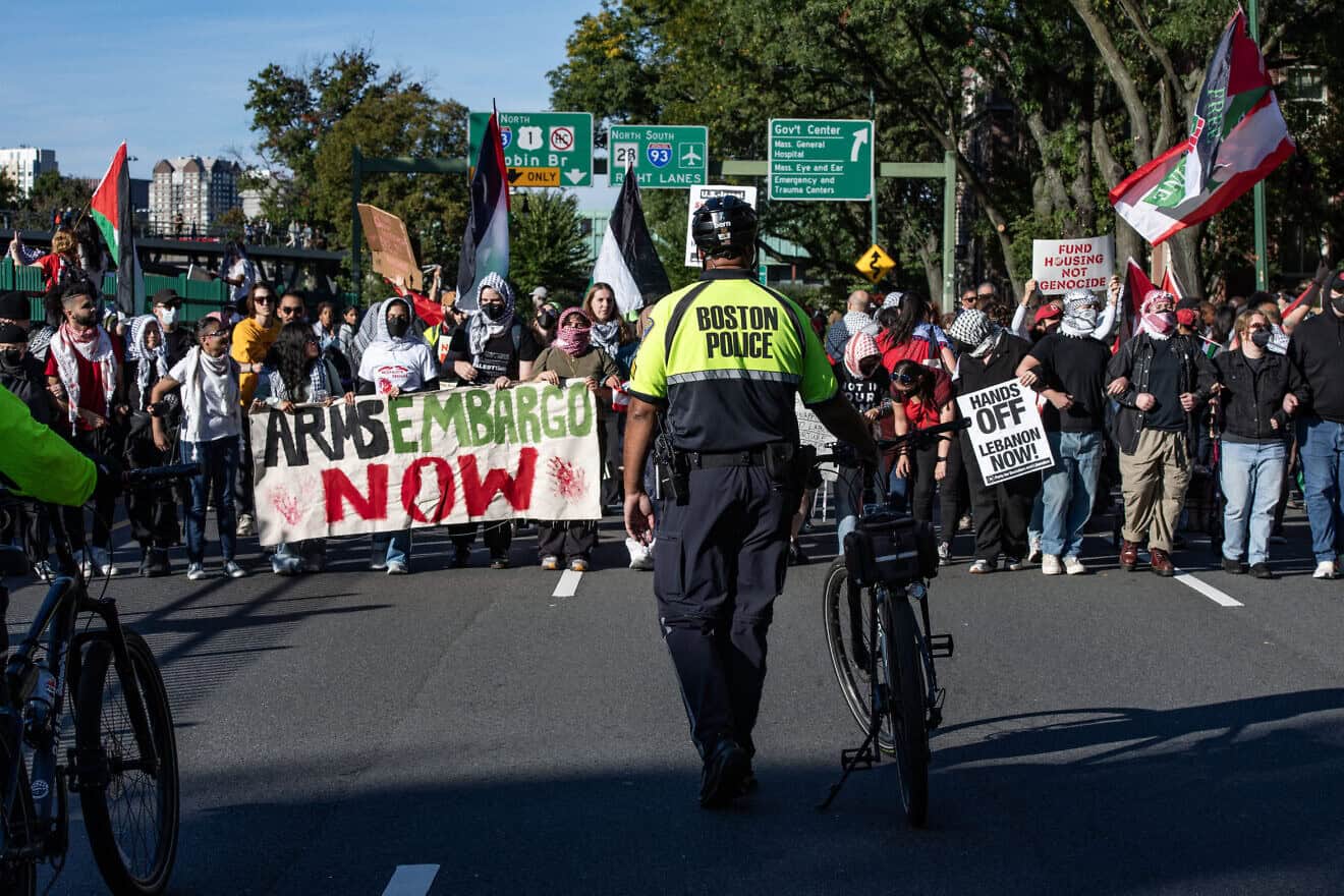 Police look on as pro-Palestinian demonstrators march during a rally to mark one year of the war between Hamas and Israel in Boston, Massachusetts on Oct. 6, 2024. Photo by Joseph Prezioso/AFP via Getty Images.