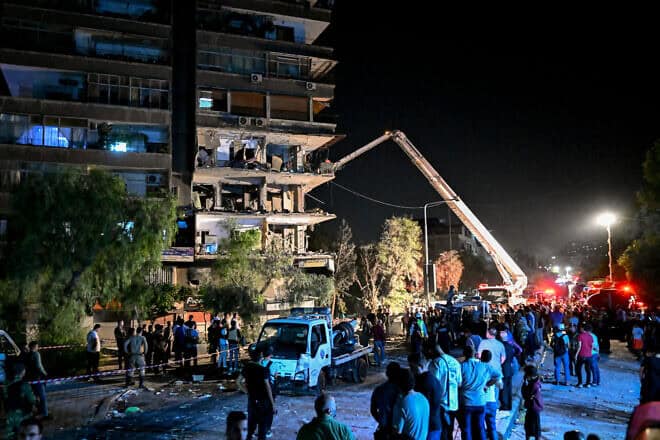 A residential building hit by a reported Israeli airstrike in the Mazzeh suburb on the western outskirts of Syria's capital of Damascus on Oct. 8, 2024. Photo by Louai Beshara/AFP via Getty Images.