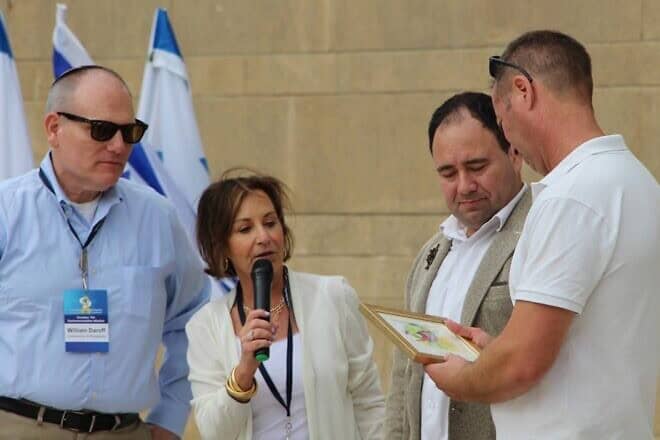 (From left) William Daroff, CEO of the Conference of Presidents of Major American Jewish Organizations; Harriet Schleifer, chair of the Conference of Presidents; Moshe Leiba, deputy director general, World ORT Kadima Mada; and Amos Gofer, CEO of Kfar Silver, at a memorial service at Kfar Silver Youth Village near Ashkelon, Israel, on Oct. 7, 2024. Credit: ORT America.
