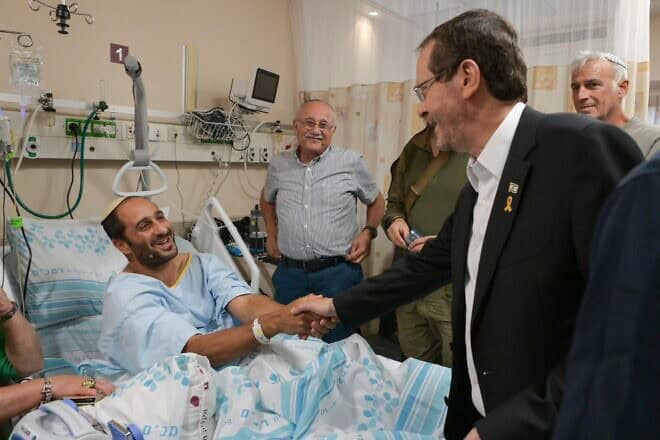 Israeli President Isaac Herzog meets with soldiers injured during the war against Hezbollah in Lebanon at Rambam Medical Center in Haifa, Oct. 15, 2024. Photo by Ma'ayan Toaf/GPO.