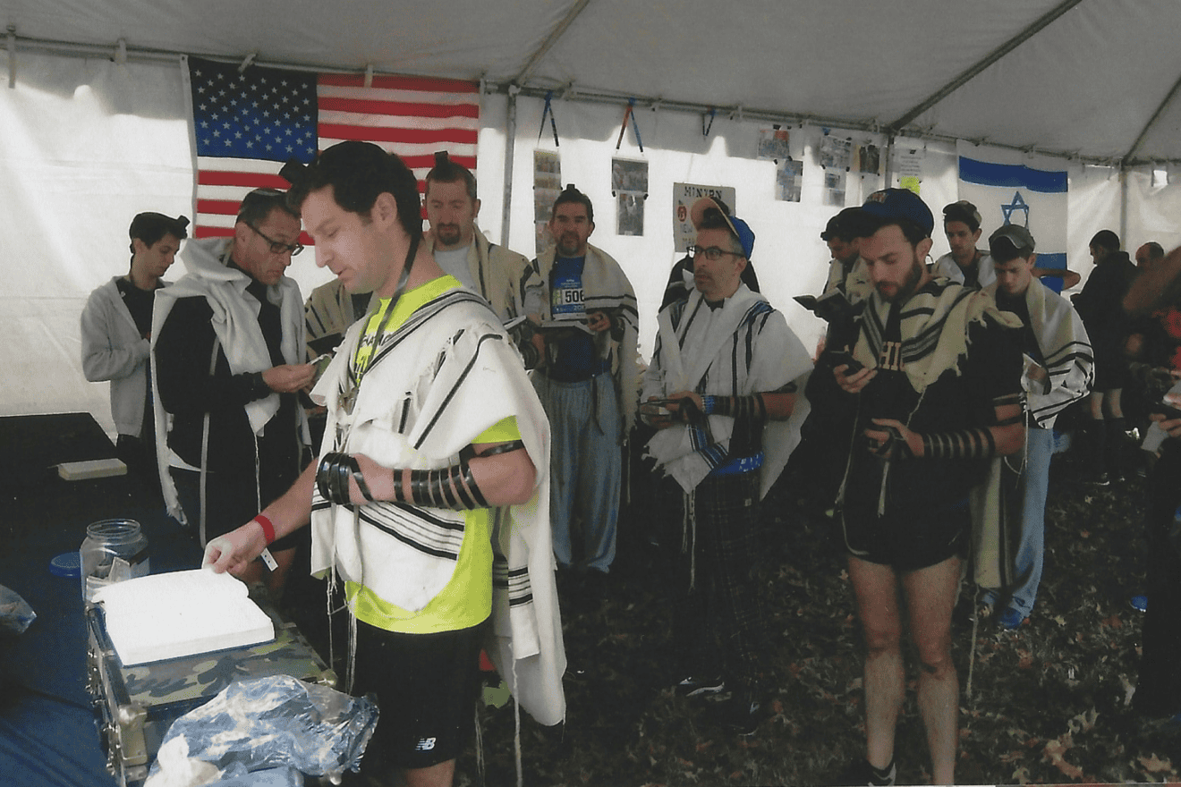 Runners at the New York City Marathon participate in the marathon minyan before start time. Credit: Courtesy of the International Minyan.