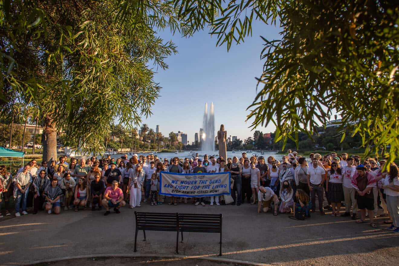 People participate in a Tashlich ritual at Echo Park Lake in Los Angeles organized by Jewish Voice for Peace to mark the one-year anniversary of the Hamas terrorist attacks on Israel Oct. 7, 2023, as well as to call for a ceasefire, Oct. 6, 2024 in Echo Park Lake in Los Angeles. Photo by Apu Gomes/AFP via Getty Images.