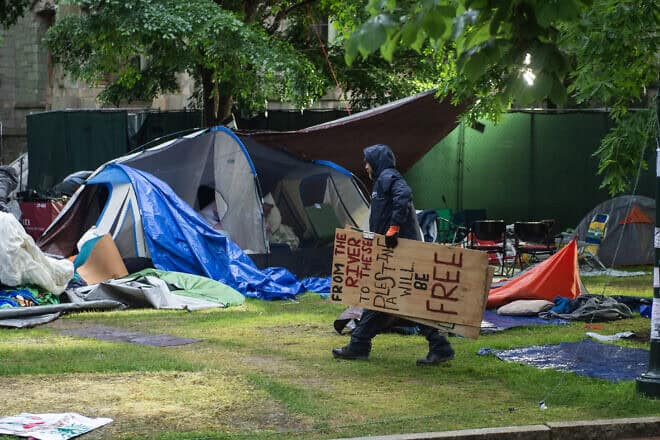 Maintenance staff and waste-disposal crews clean up after police cleared a pro-Palestinian protest encampment on the campus of the University of Pennsylvania in Philadelphia on May 10, 2024. Photo by Matthew Hatcher/AFP via Getty Images.