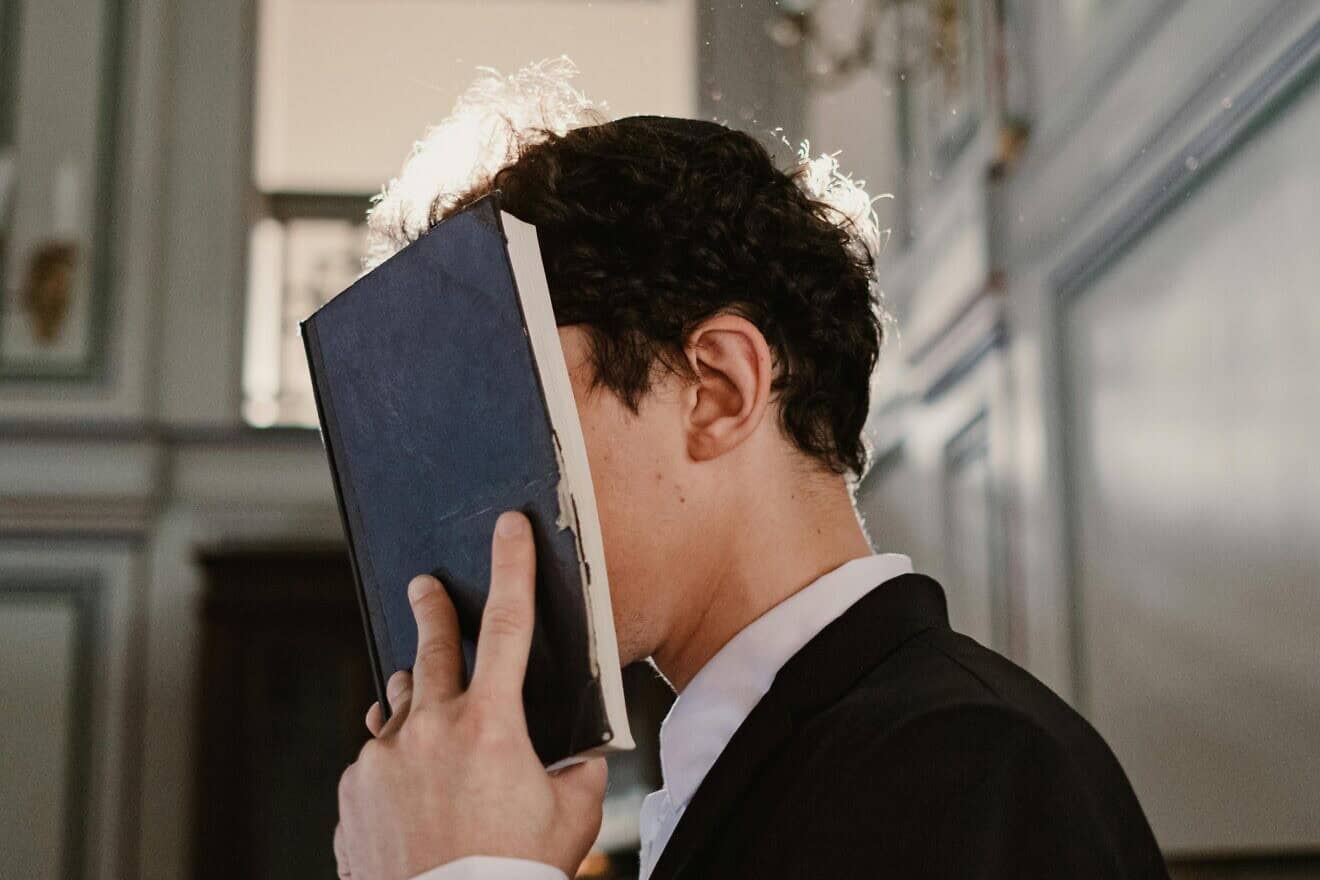 At prayer. Photo by Cottonbro Studio/Pexels.