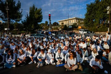 Families of Israelis held hostage in the Gaza Strip and supporters dress in white as they attend a silent protest calling for the release of Israelis held hostage in the Gaza Strip, outside the Knesset, the Israeli Parliament in Jerusalem, Nov. 4, 2024. Photo by Chaim Goldberg/Flash90.
