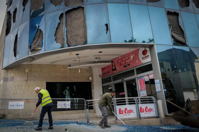 Residents of Kiryat Shmona check last night's missile-attack damage at the city's central bus station and mall on Nov. 27, 2024. Photo by Michael Giladi/Flash90.