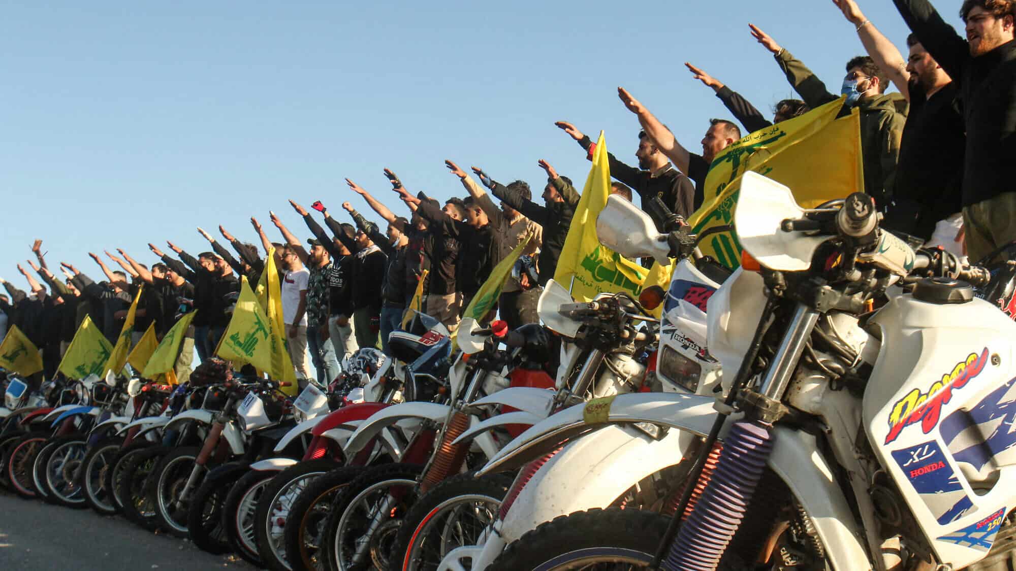 Hezbollah terrorists salute in Lebanon's Marjayoun District, near the border with Israel, May 25, 2020. Photo by Mahmoud Zayyat/AFP via Getty Images.