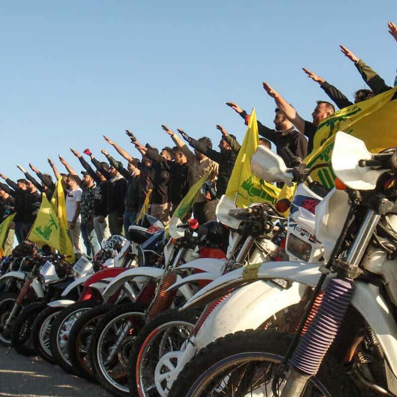 Hezbollah terrorists salute in Lebanon's Marjayoun District, near the border with Israel, May 25, 2020. Photo by Mahmoud Zayyat/AFP via Getty Images.