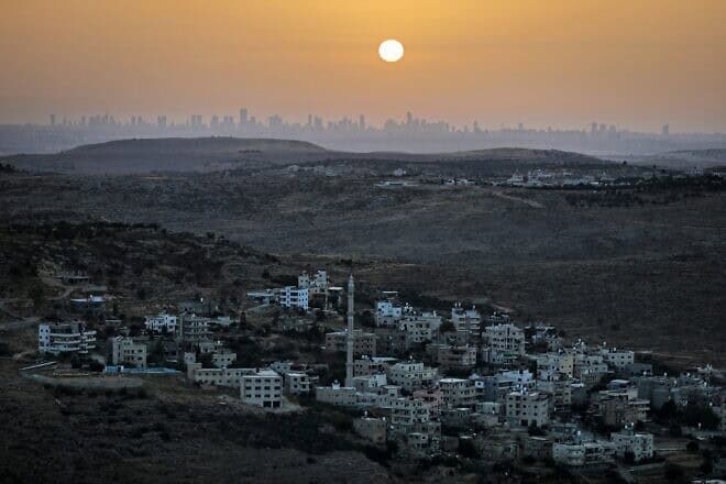 The Tel Aviv skyline as seen from western Samaria, June 17, 2020. Photo by Menahem Kahana/AFP via Getty Images.