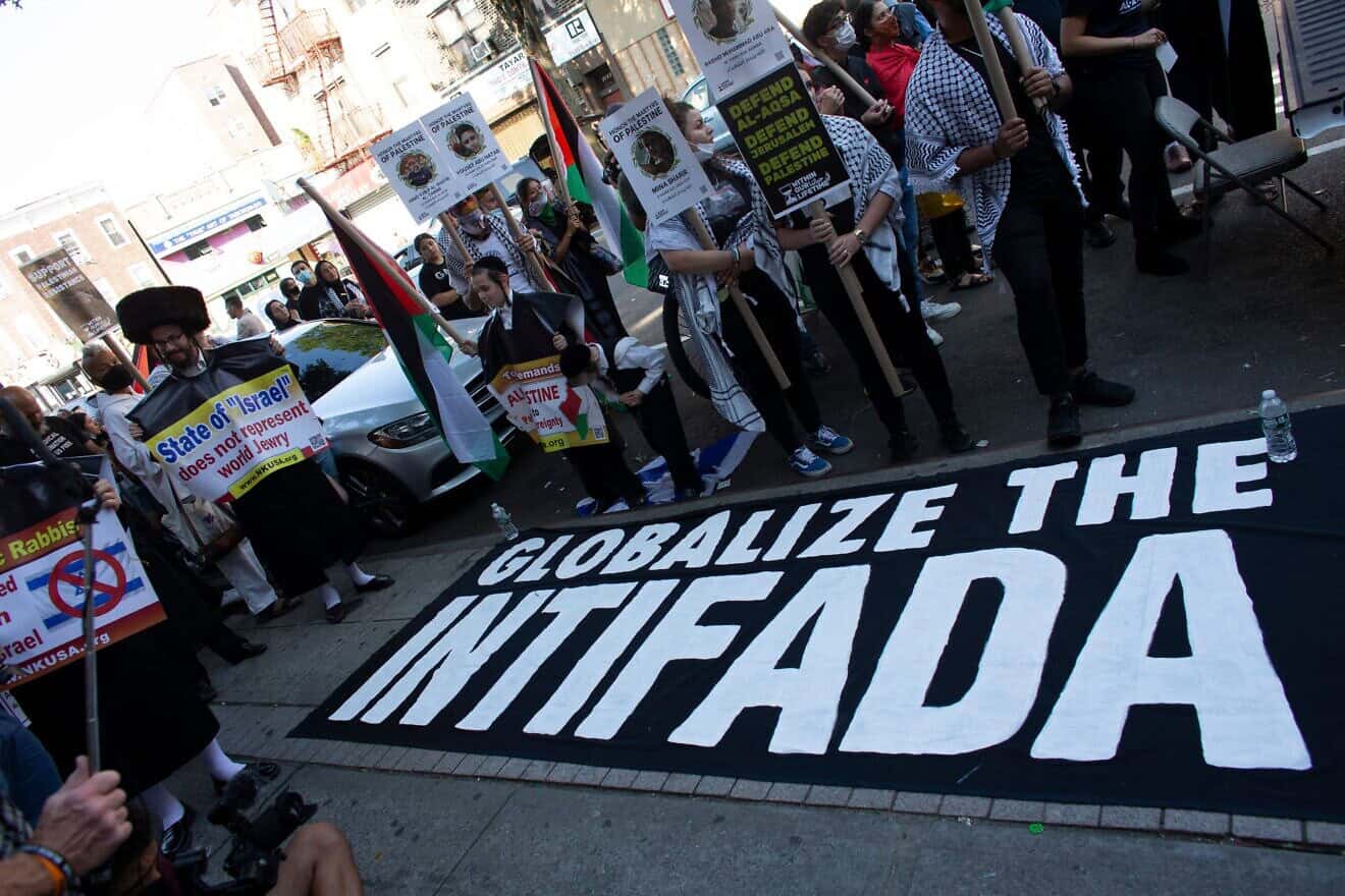 A sign reading "Globalize the Intifada" is seen on the ground in Brooklyn, N.Y., on July 31, 2021. Photo by Kena Betancur/AFP via Getty Images.