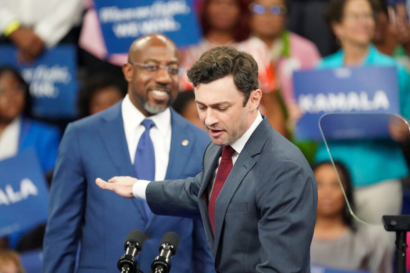 Sens. Raphael Warnock and Jon Ossoff (both D-Ga.) speak onstage at a campaign rally for Democratic presidential candidate, U.S. Vice President Kamala Harris at the Georgia State Convocation Center in Atlanta, Ga., on July 30, 2024. Photo by Julia Beverly/Getty Images.