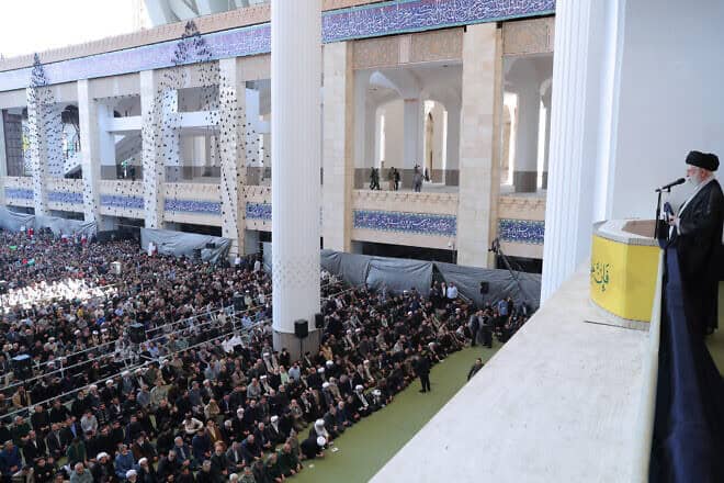 In this handout image provided by the Iranian Leader's Press Office, Iranian Supreme Leader Ayatollah Ali Khamenei stands with a rifle as he leads Friday prayers at the Imam Khomeini Musalla Mosque in Tehran, Iran, on Oct. 4, 2024. Photo by Iranian Leader's Press Office/Getty Images.